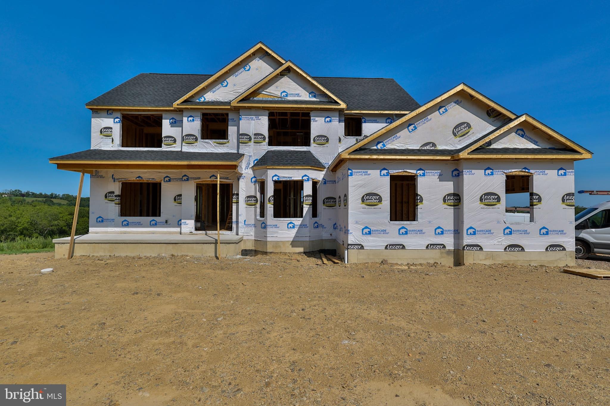 a front view of a house with yard