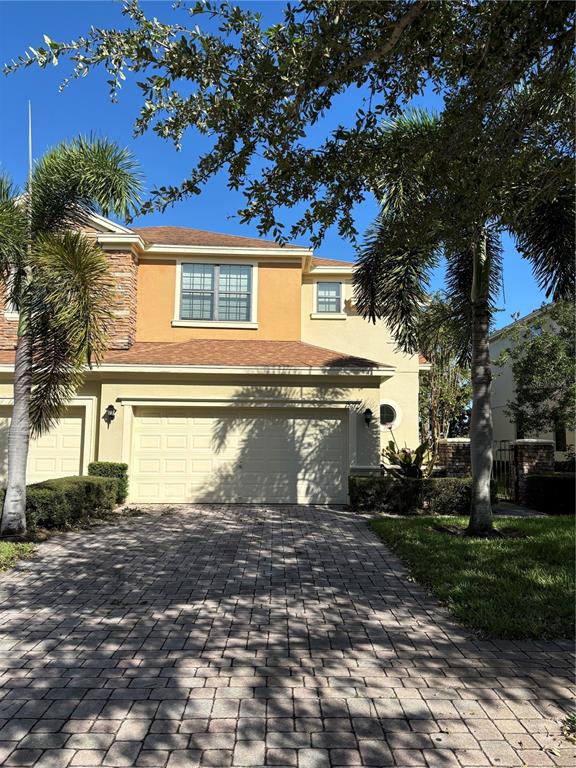 a view of a house with a backyard