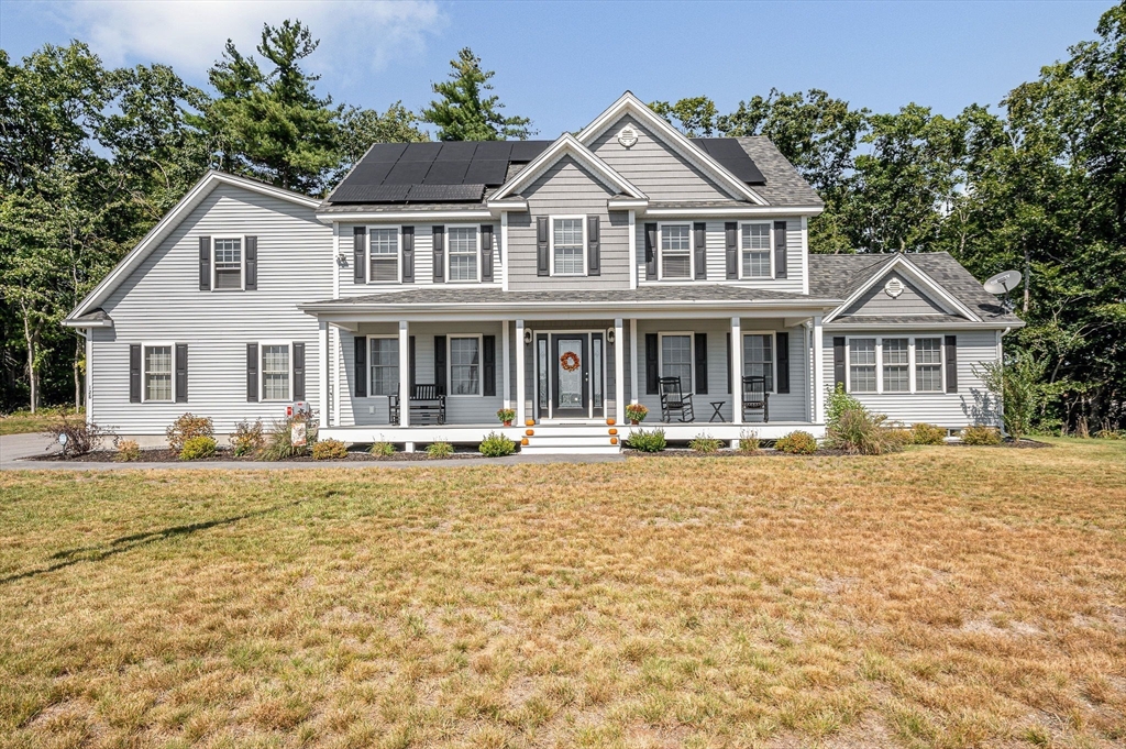 a house with lots of trees in the background