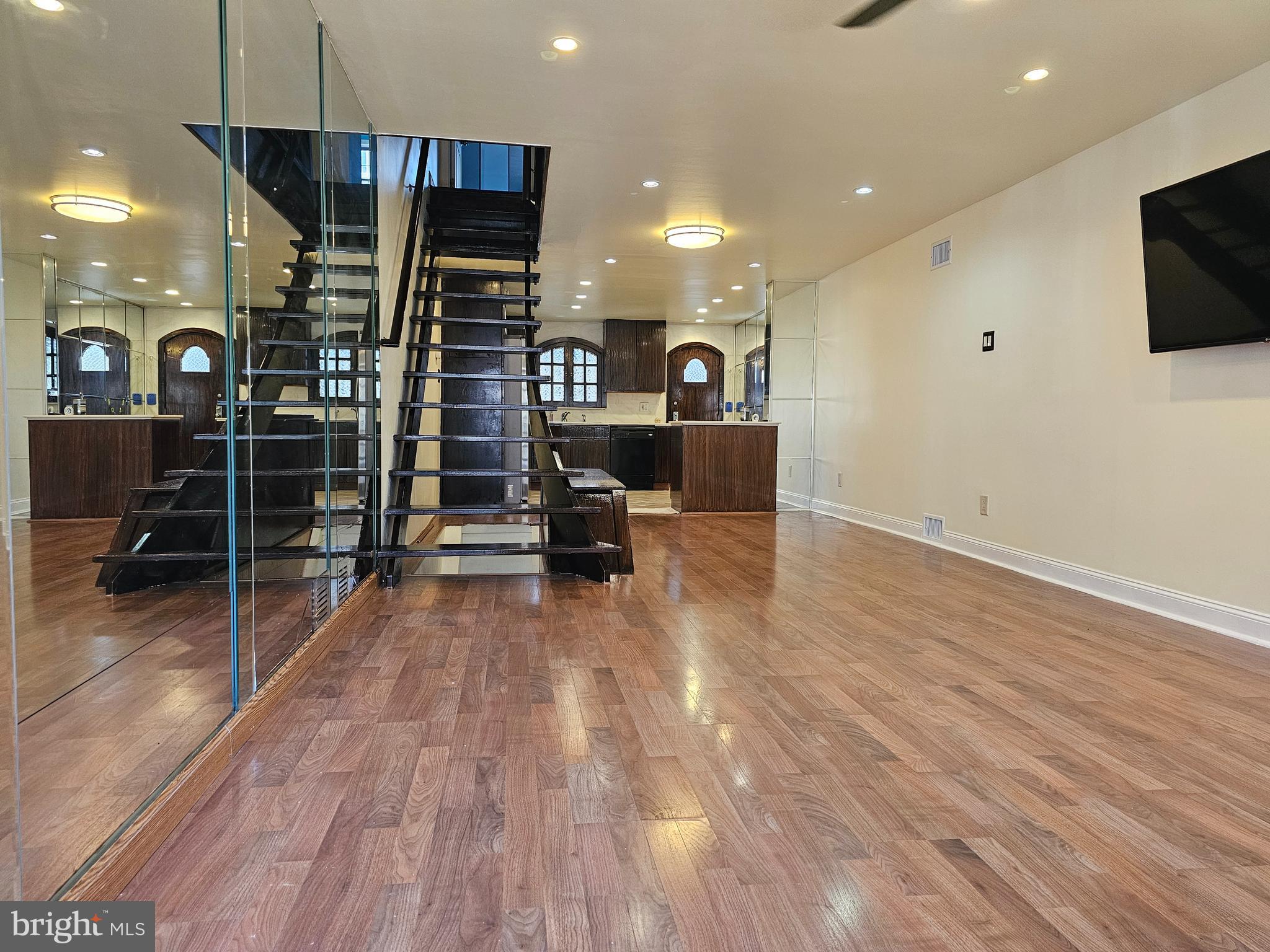 a view of a livingroom with furniture and a flat screen tv