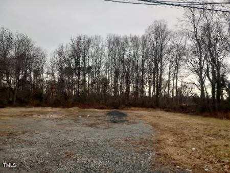 a view of a yard with trees