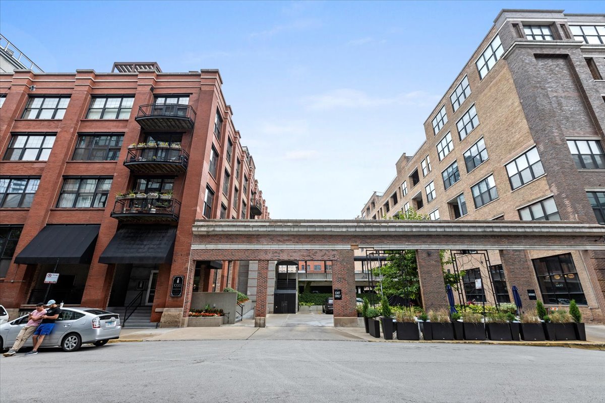 a view of a building with a lot of cars on deck