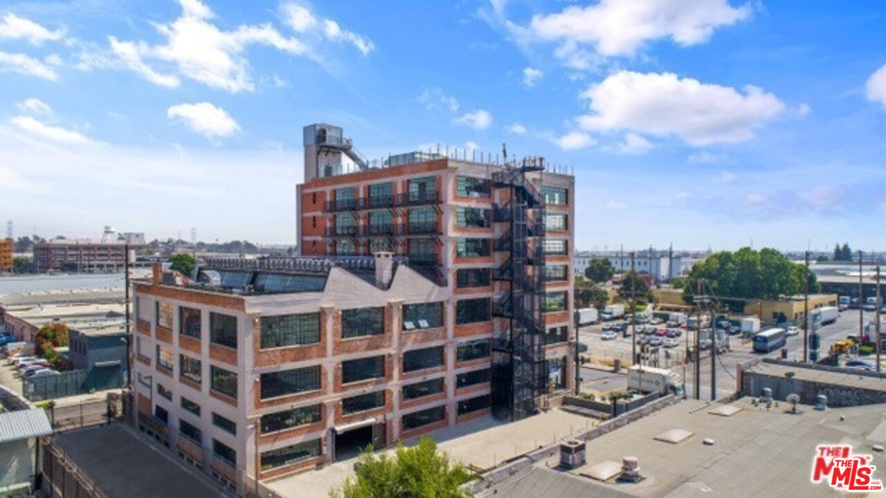 a view of a building with a yard