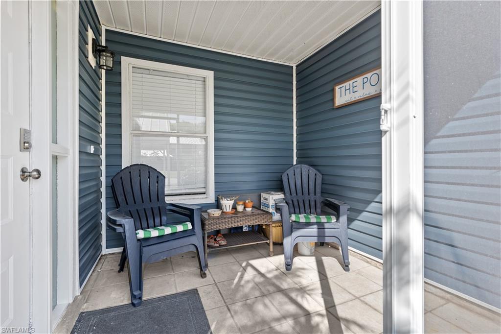 a balcony with chairs and with outdoor views