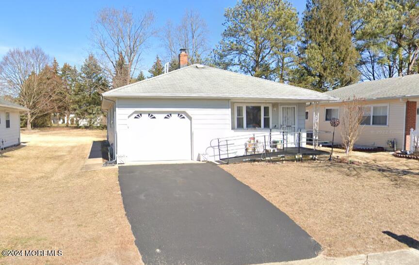 a view of a house with snow on the background