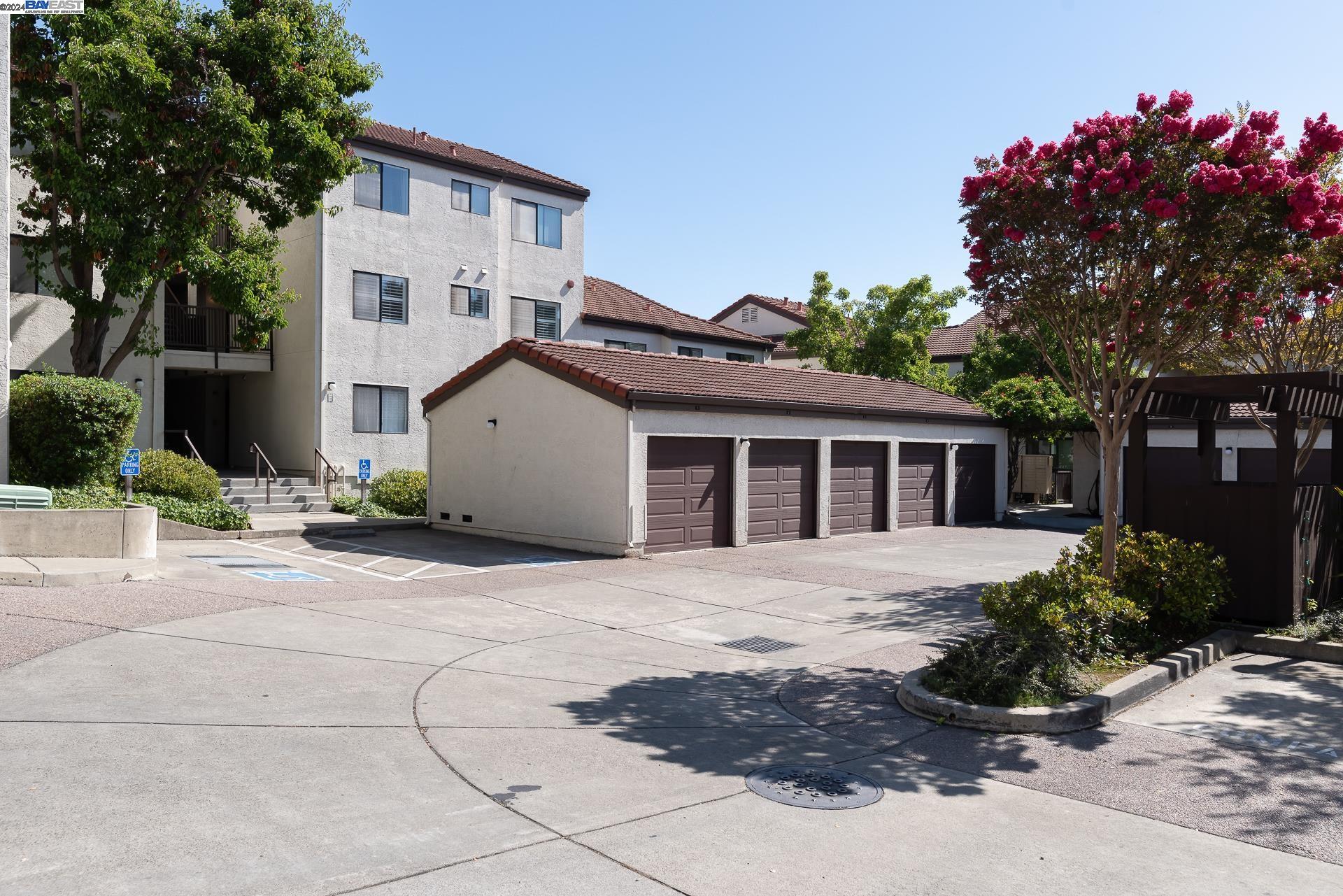 a front view of a house with a yard and a garage