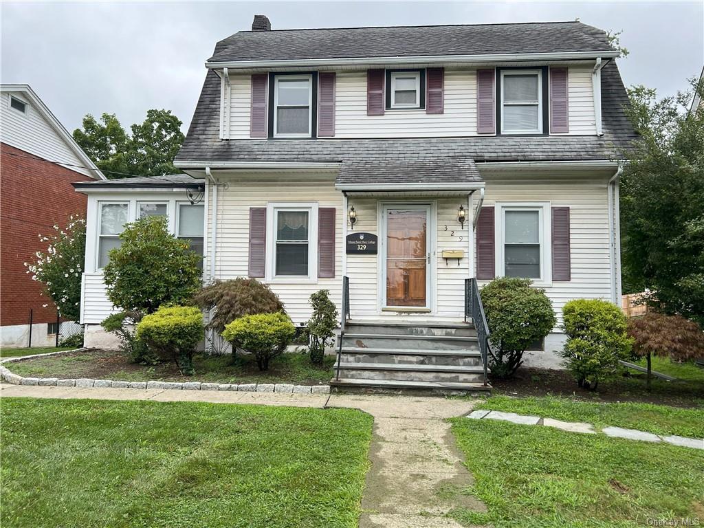 View of front of home with a front yard