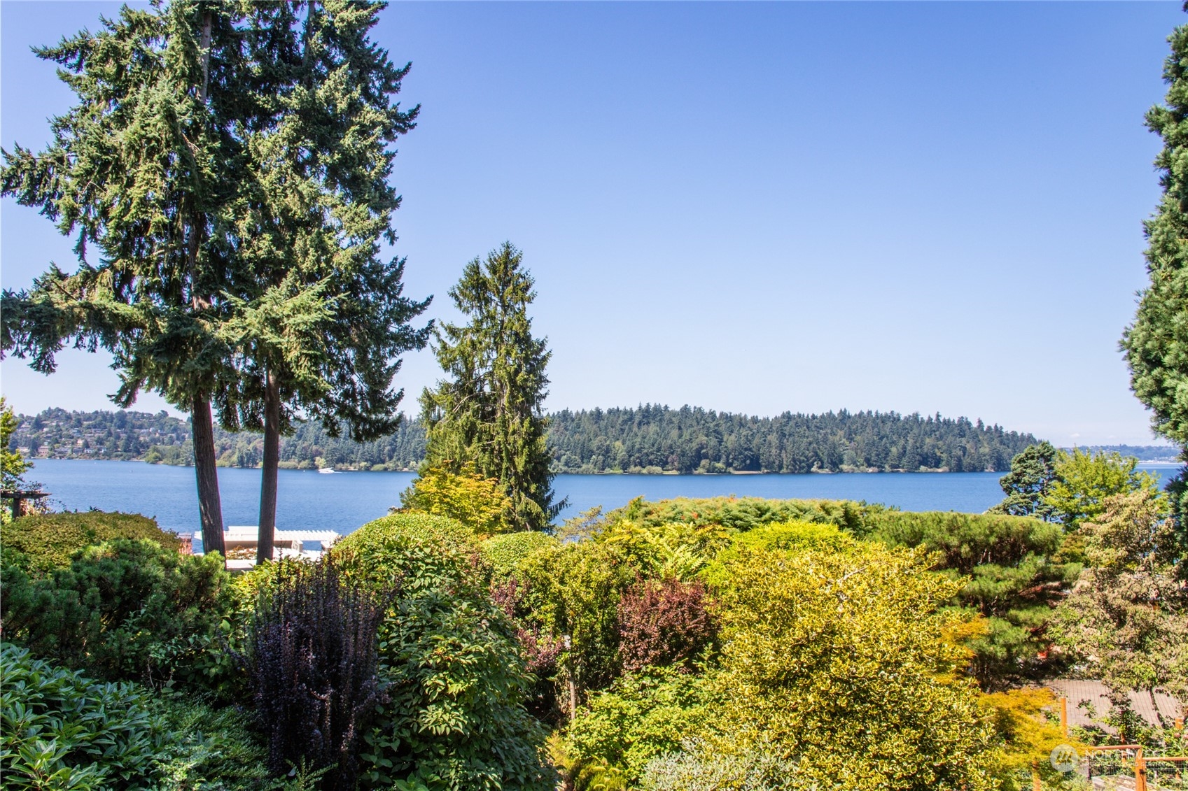 a view of a lake with a house in the background