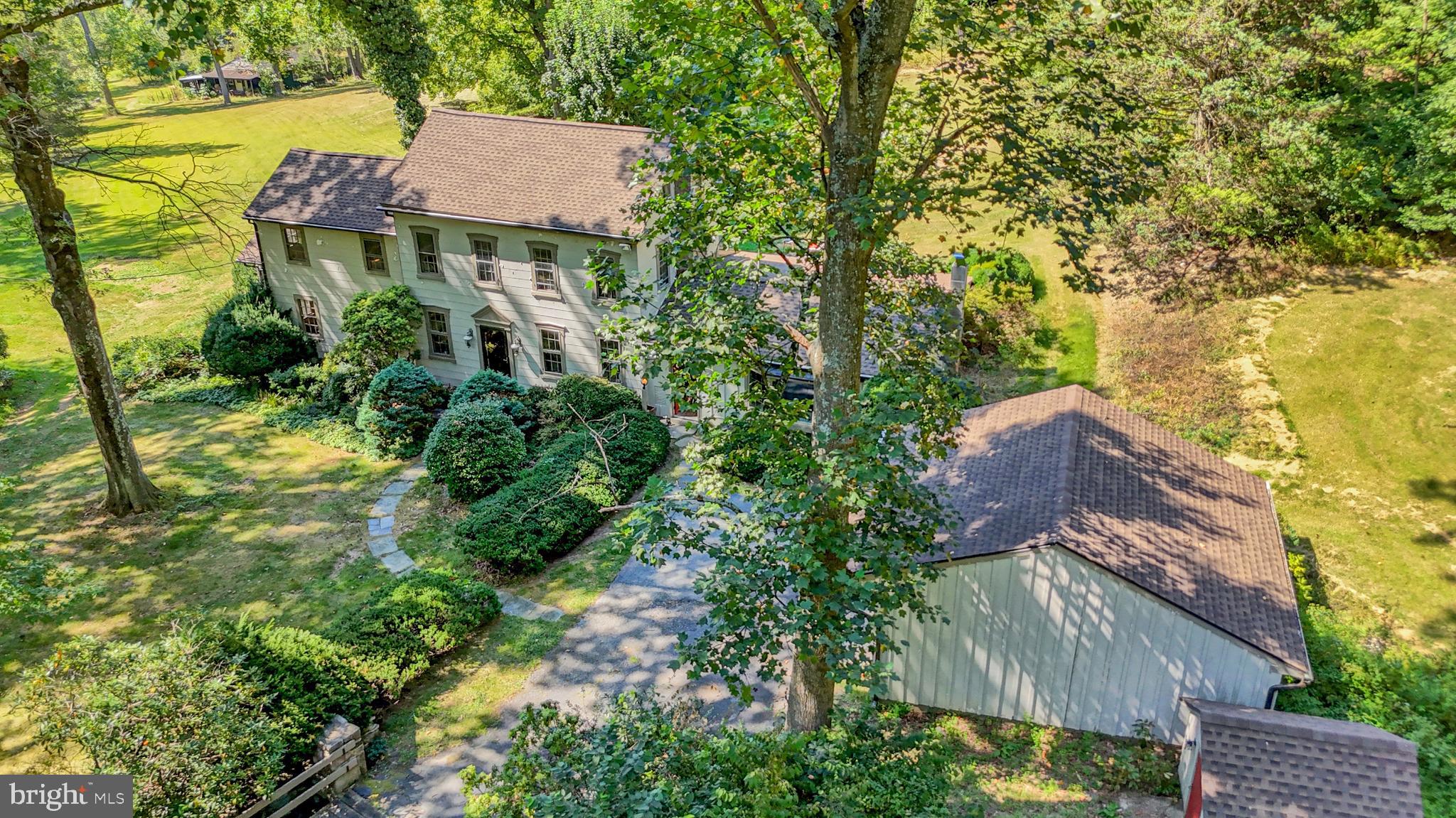 an aerial view of residential houses with yard