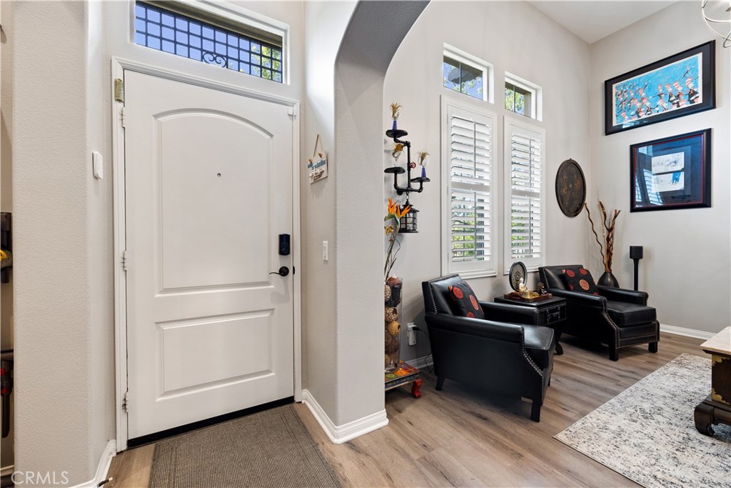 a living room with furniture and a mirror