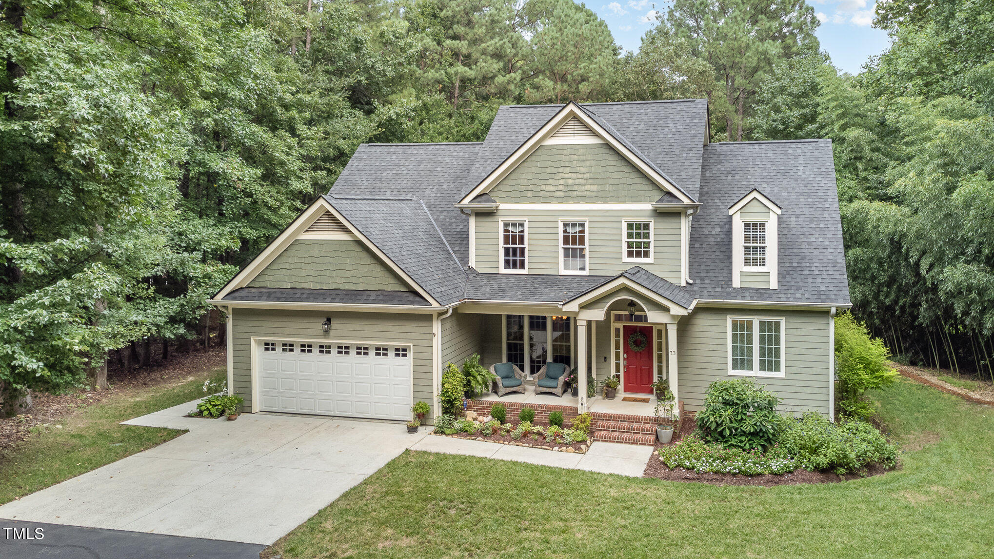 front view of a house with a yard