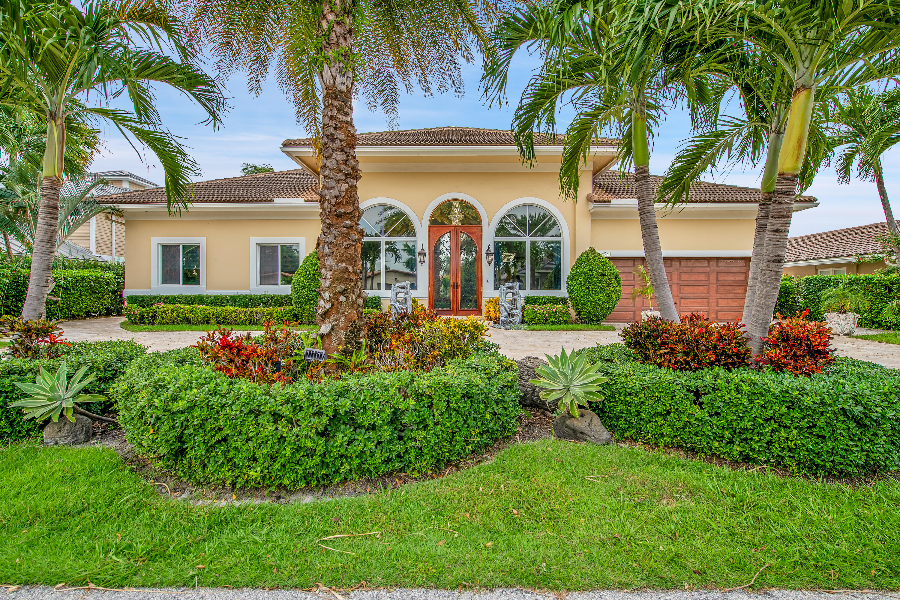 front view of a house with a garden