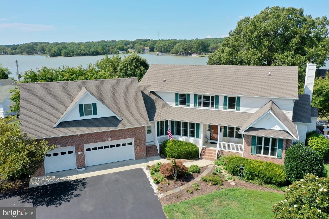 an aerial view of multiple houses with a yard