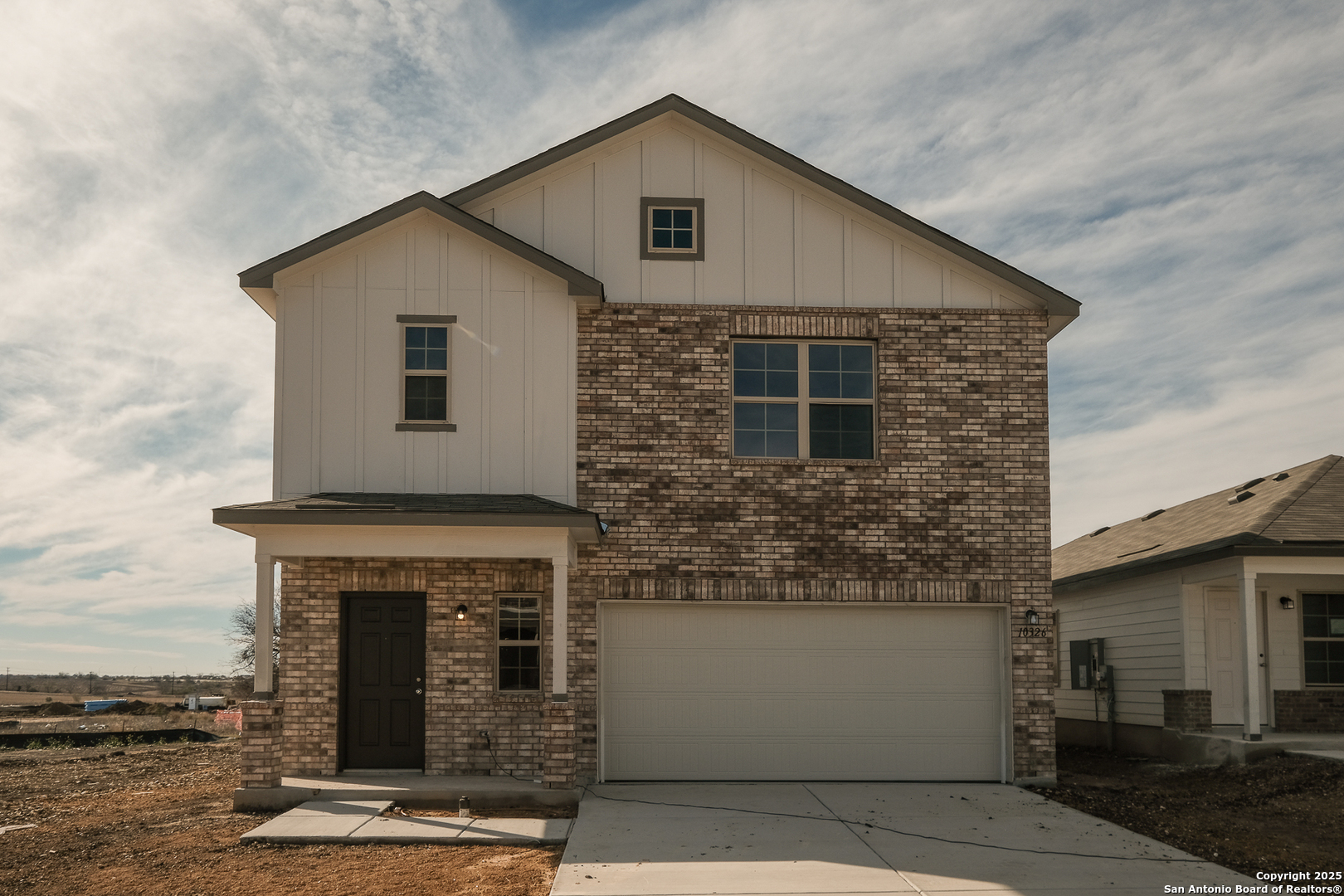 a front view of a house with yard