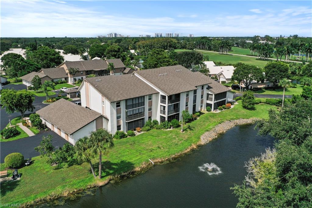 an aerial view of a house with garden space and street view