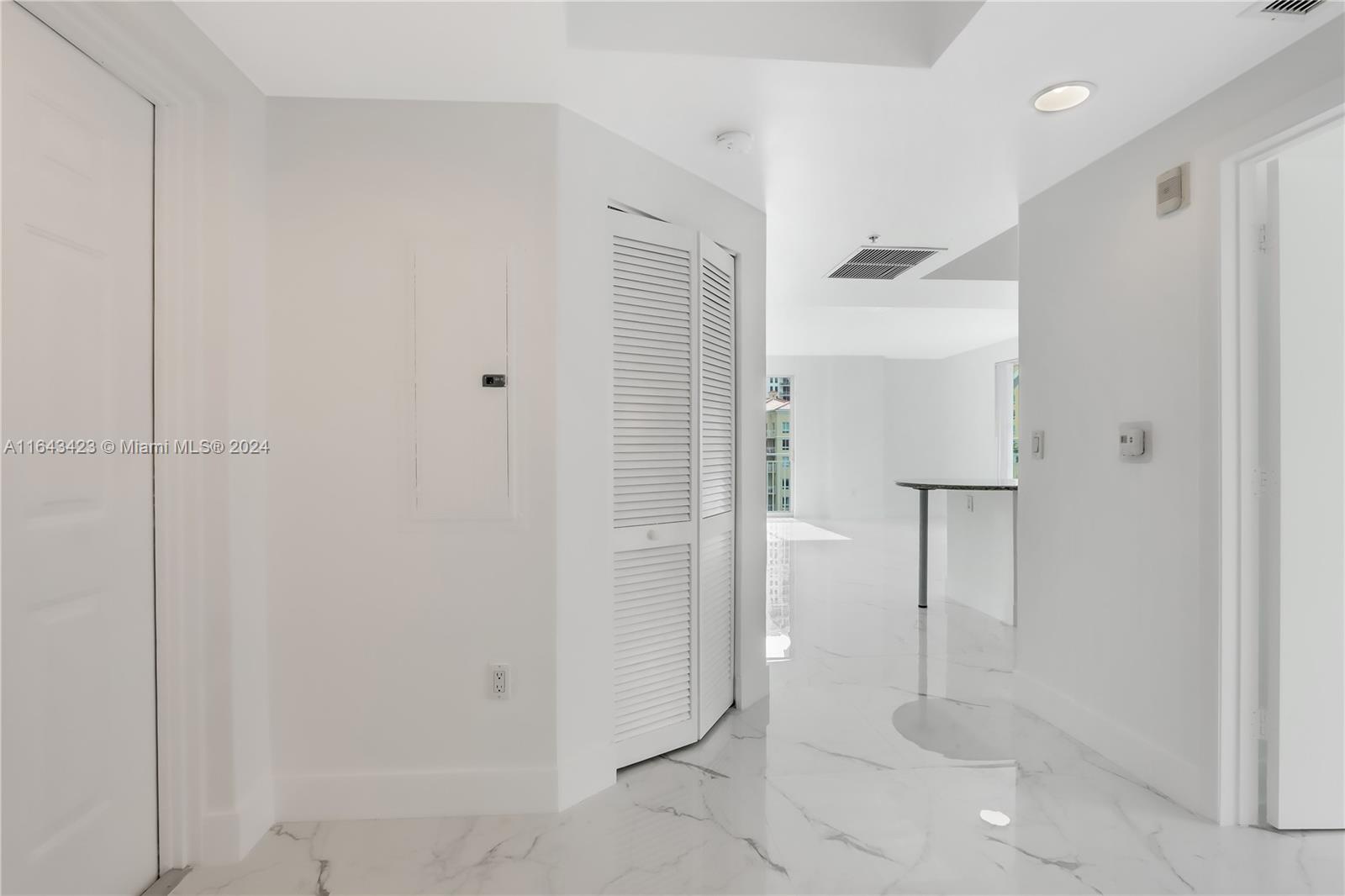 a bathroom with a shower and a glass door