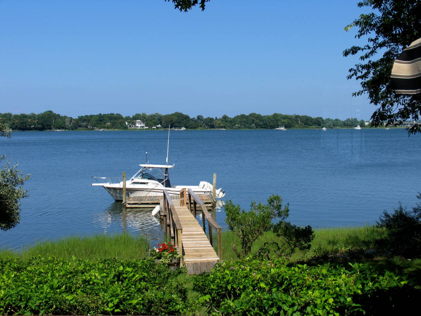 an aerial view of a house with a lake view