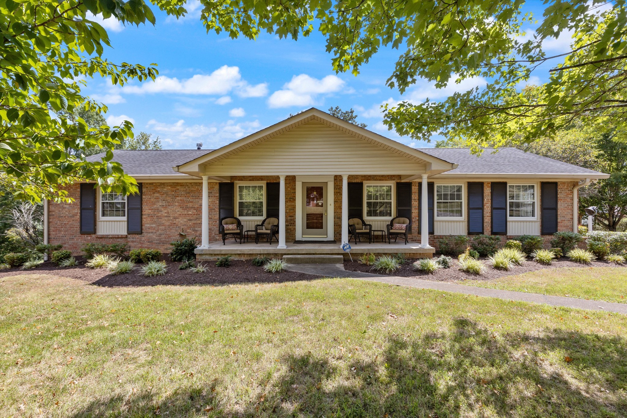 a front view of a house with a yard