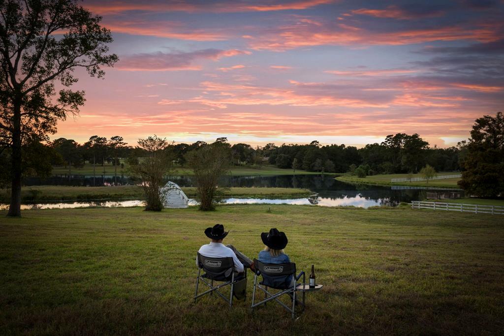 a view of a lake with outdoor seating