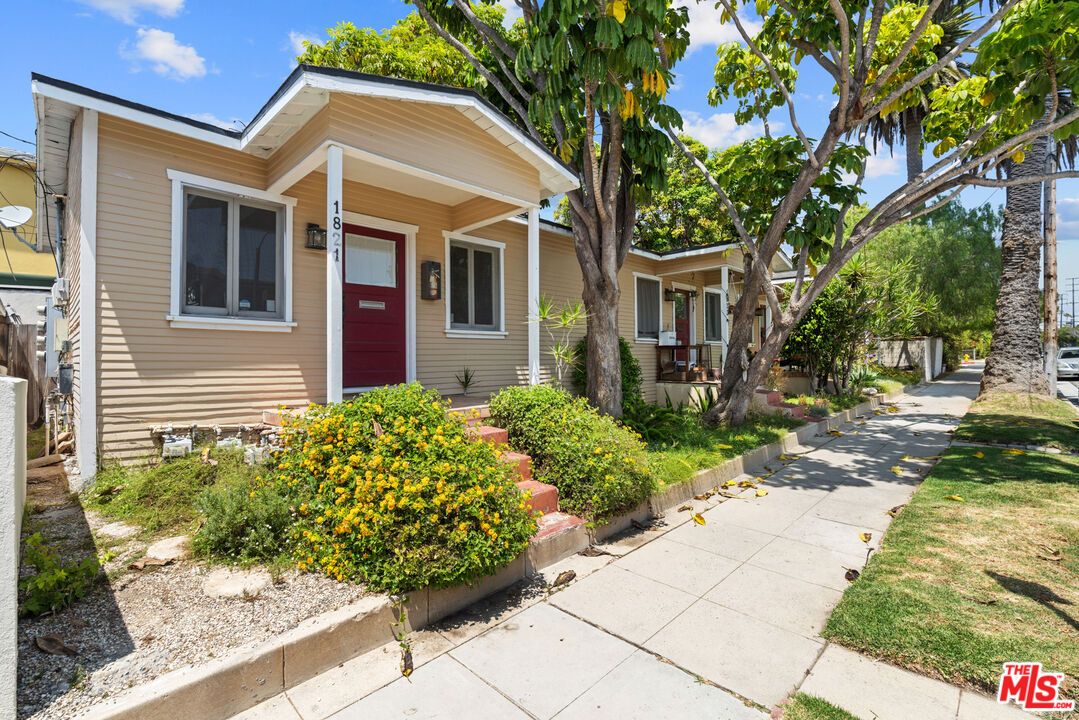 a front view of a house with garden