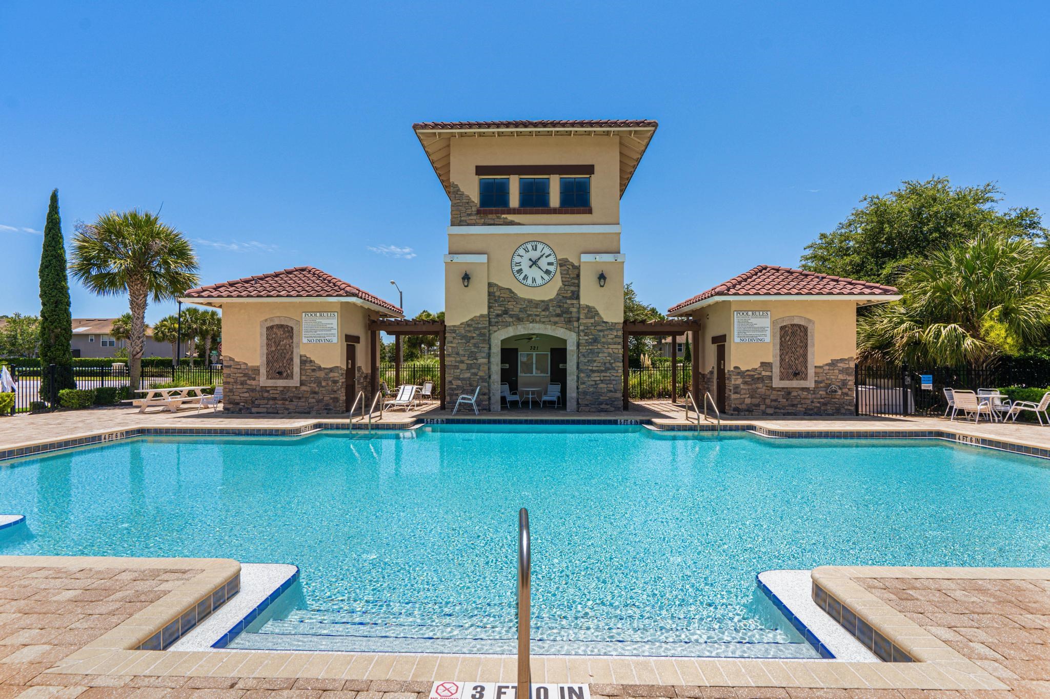 a house with swimming pool in front of it