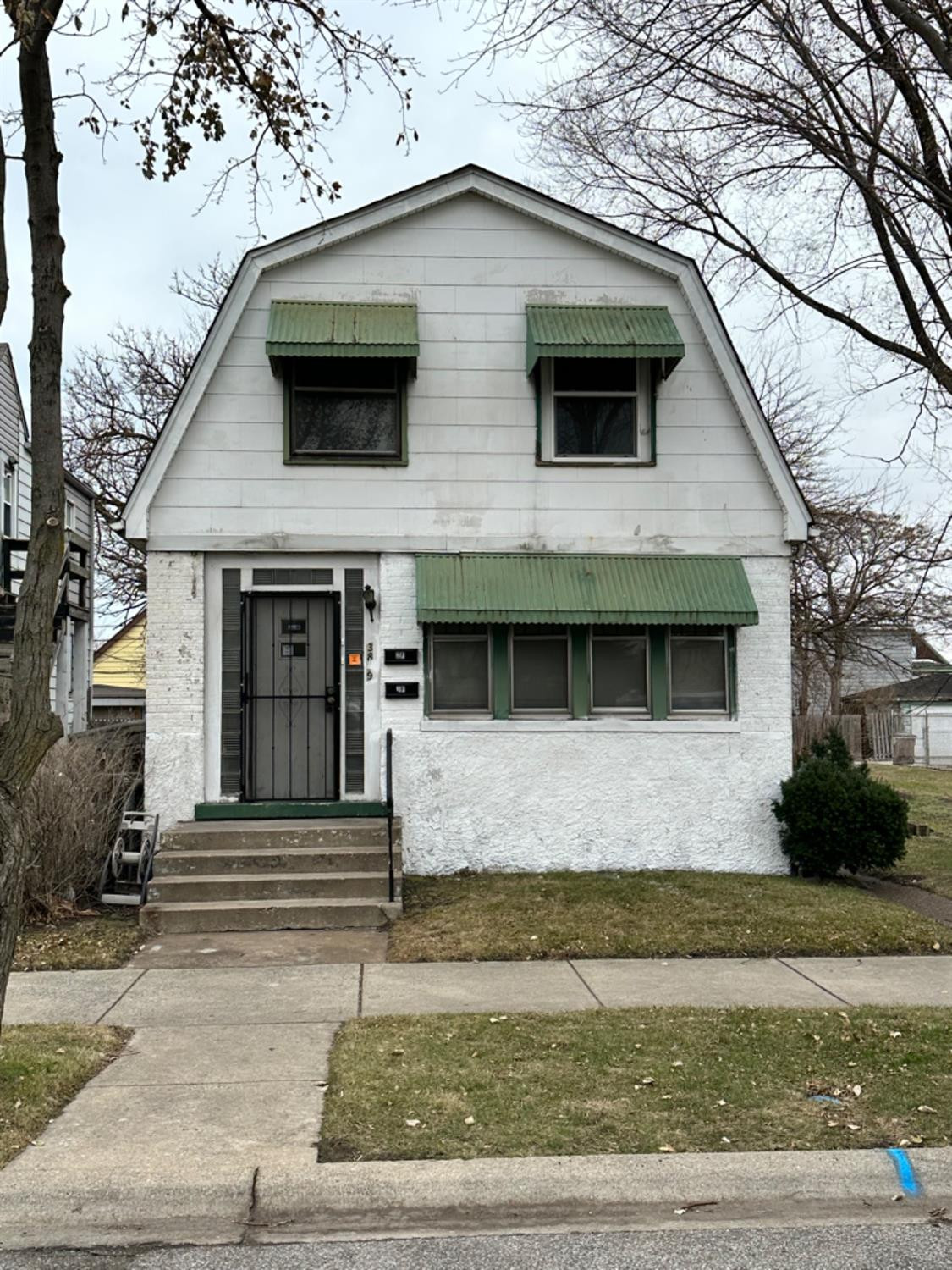 a front view of a house with garage