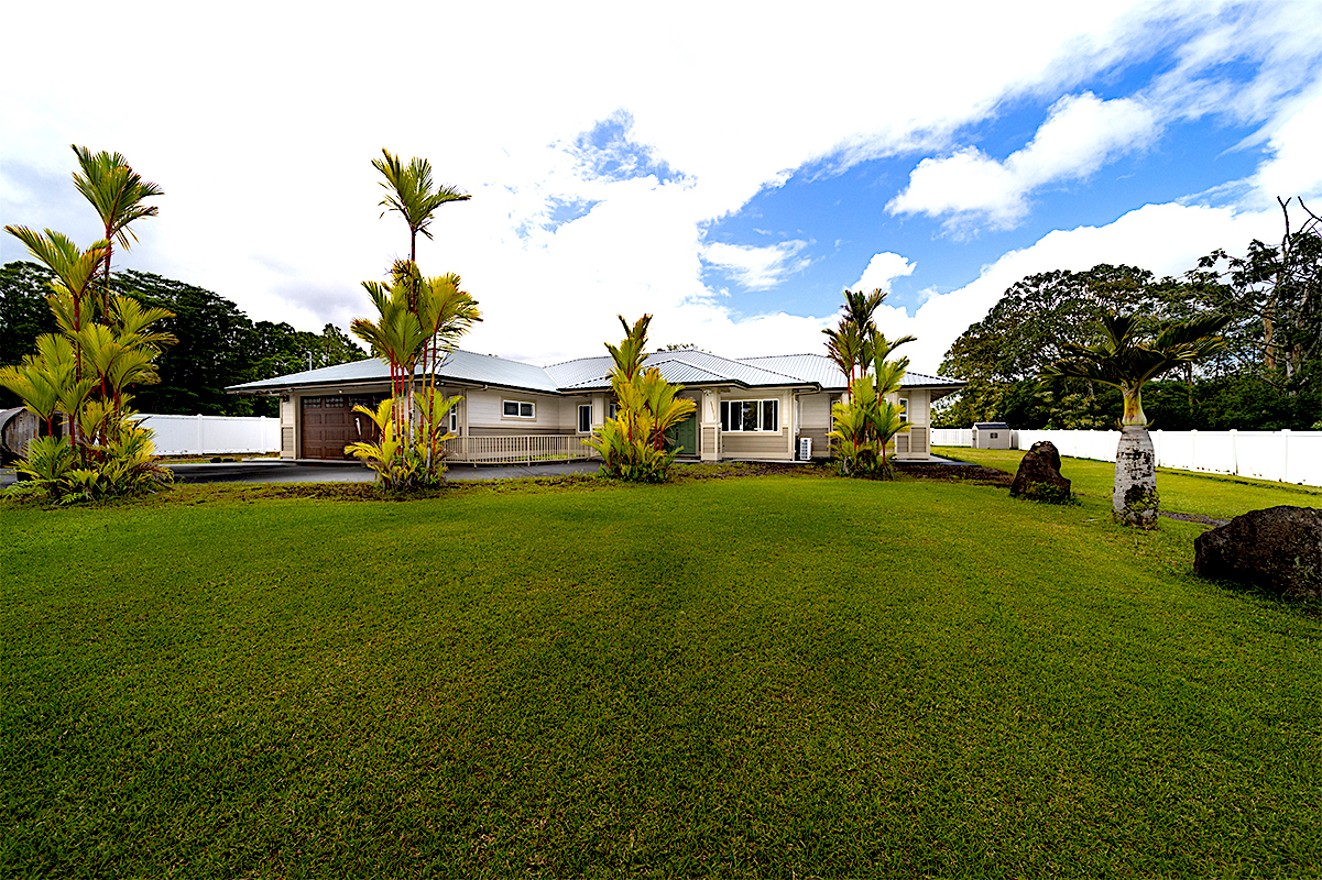 a view of a house with a back yard