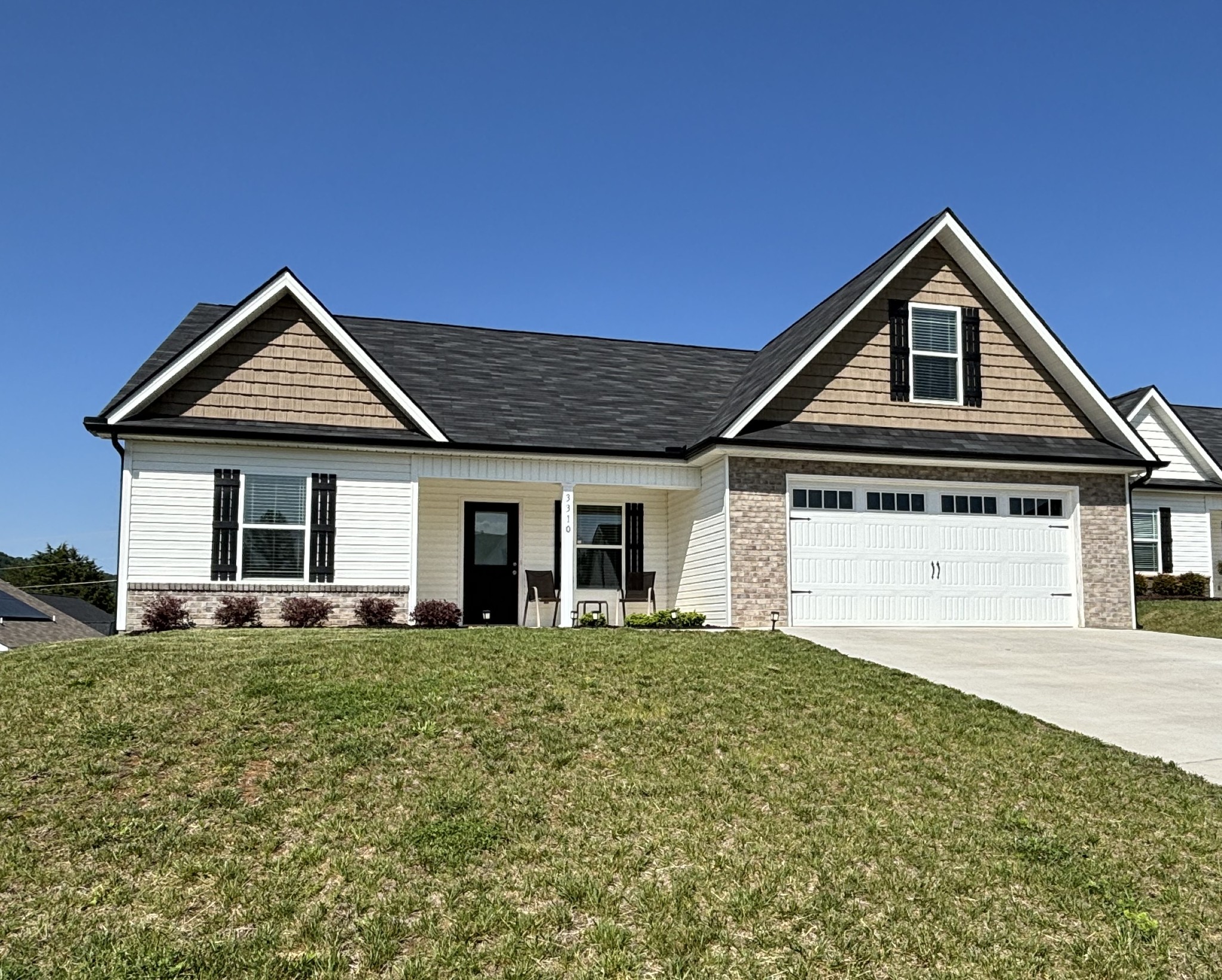 a front view of a house with yard