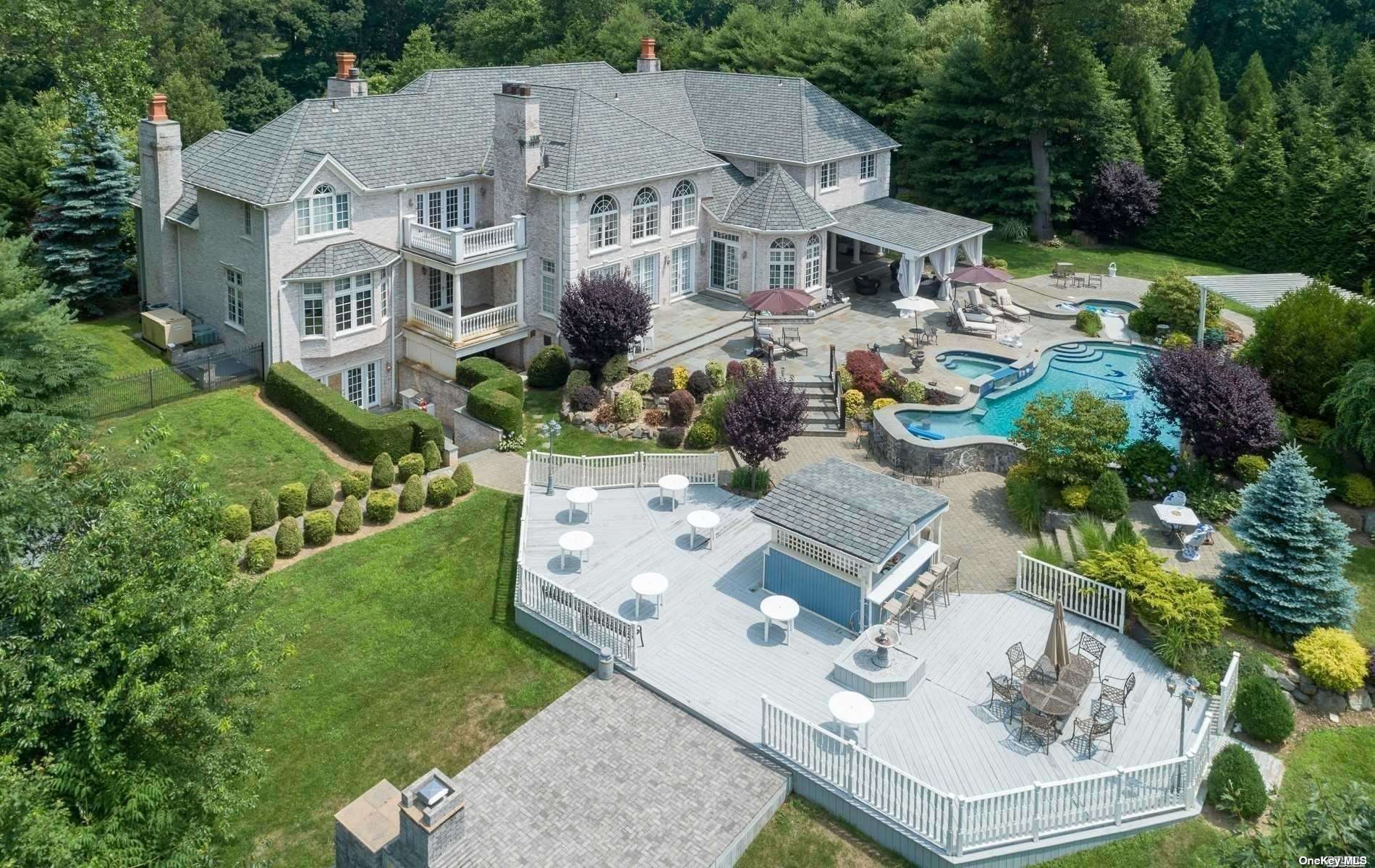 an aerial view of a house with garden space and street view