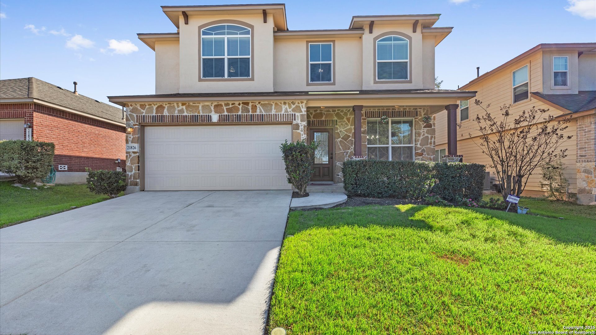 front view of a house with a yard