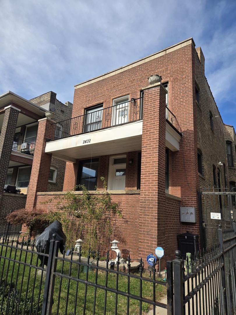 a front view of a house with glass windows