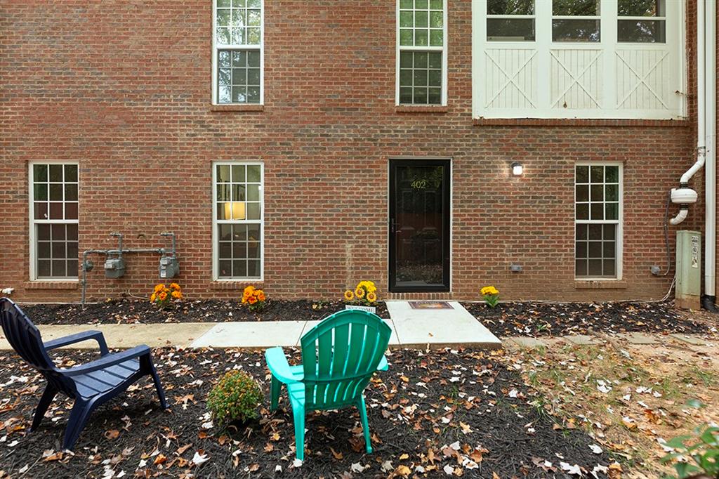 a front view of a house with outdoor seating