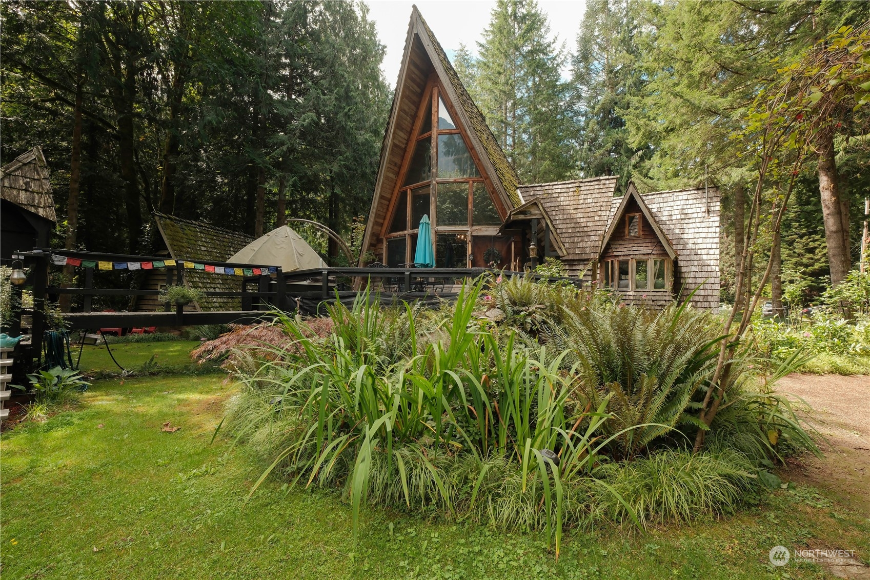 a view of house with backyard and swimming pool