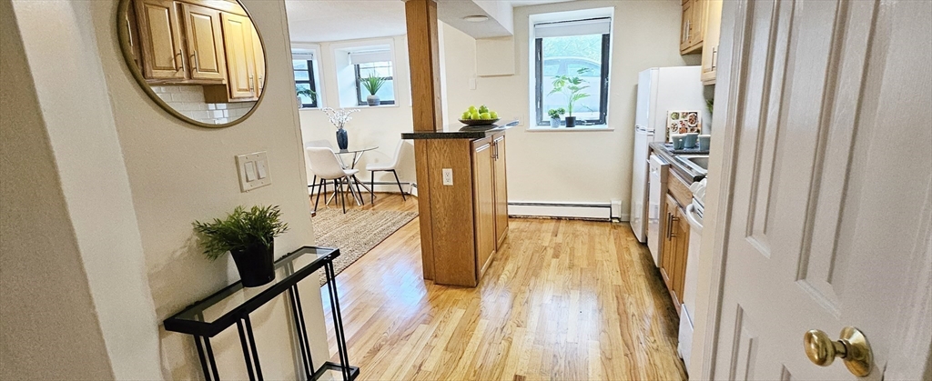 a view of living room and wooden floor