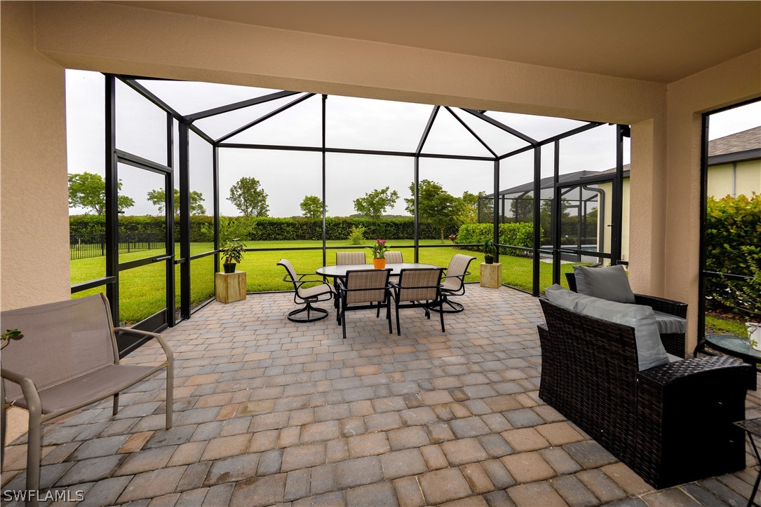 a view of a floor to ceiling window and couch in the patio