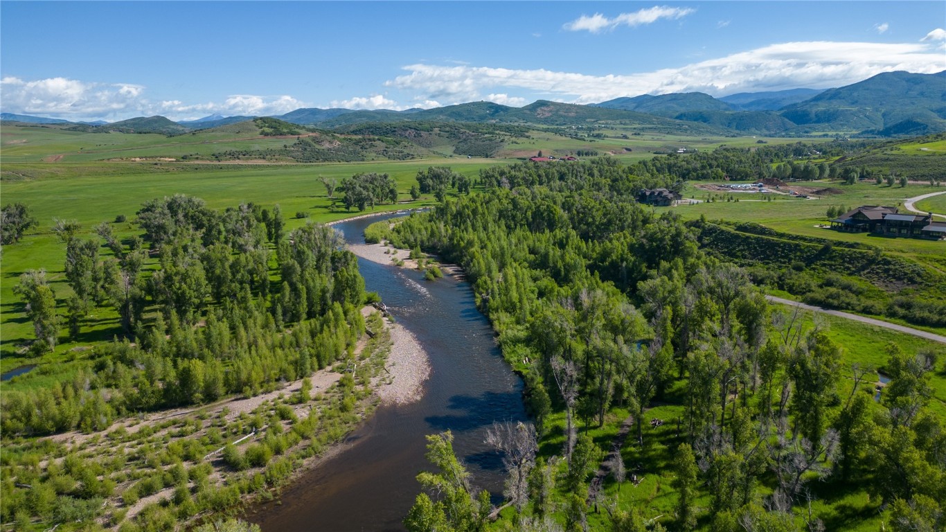 Bird's eye view featuring a rural view and a water and mountain view