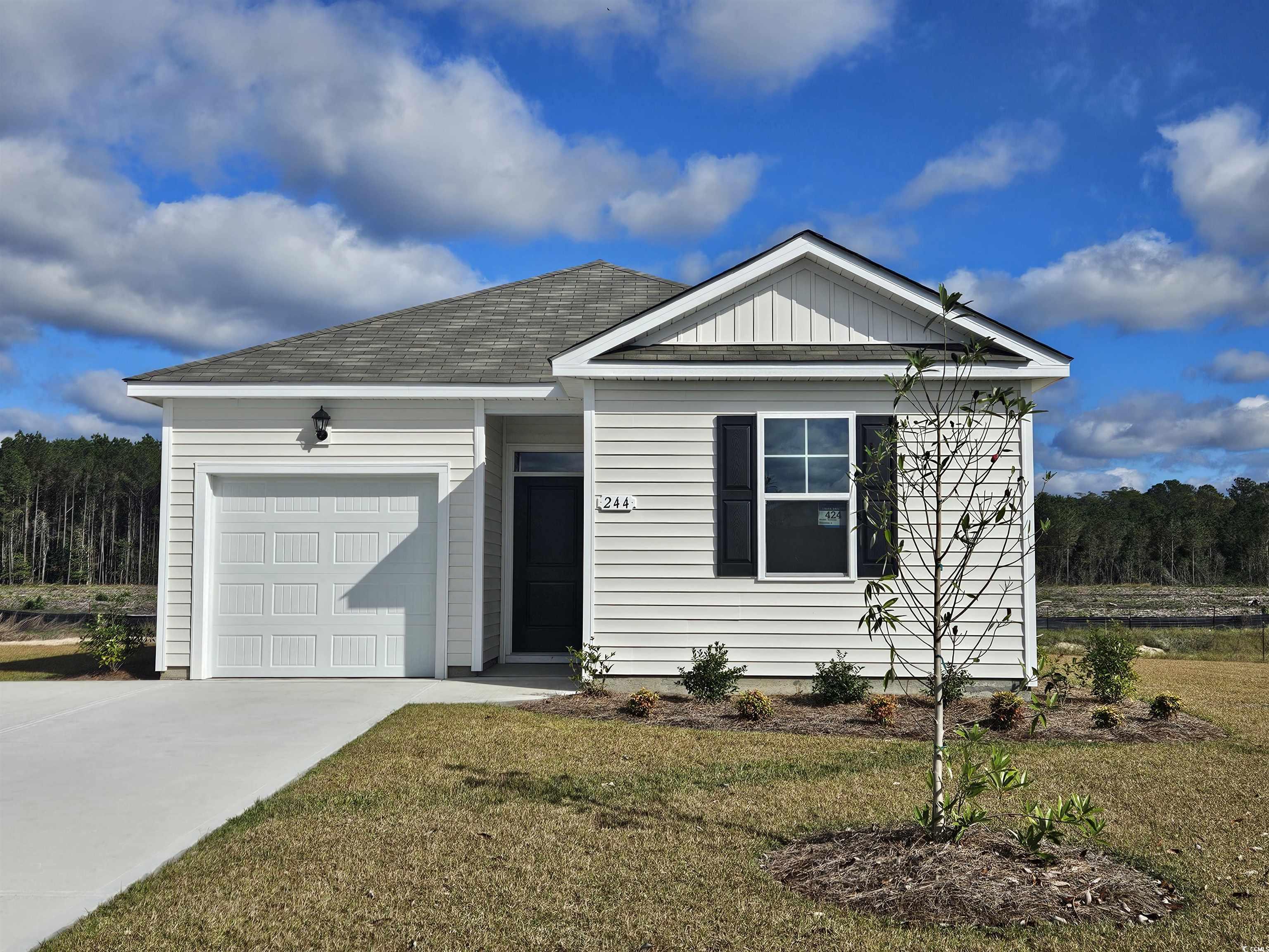 View of front of property featuring a front yard a