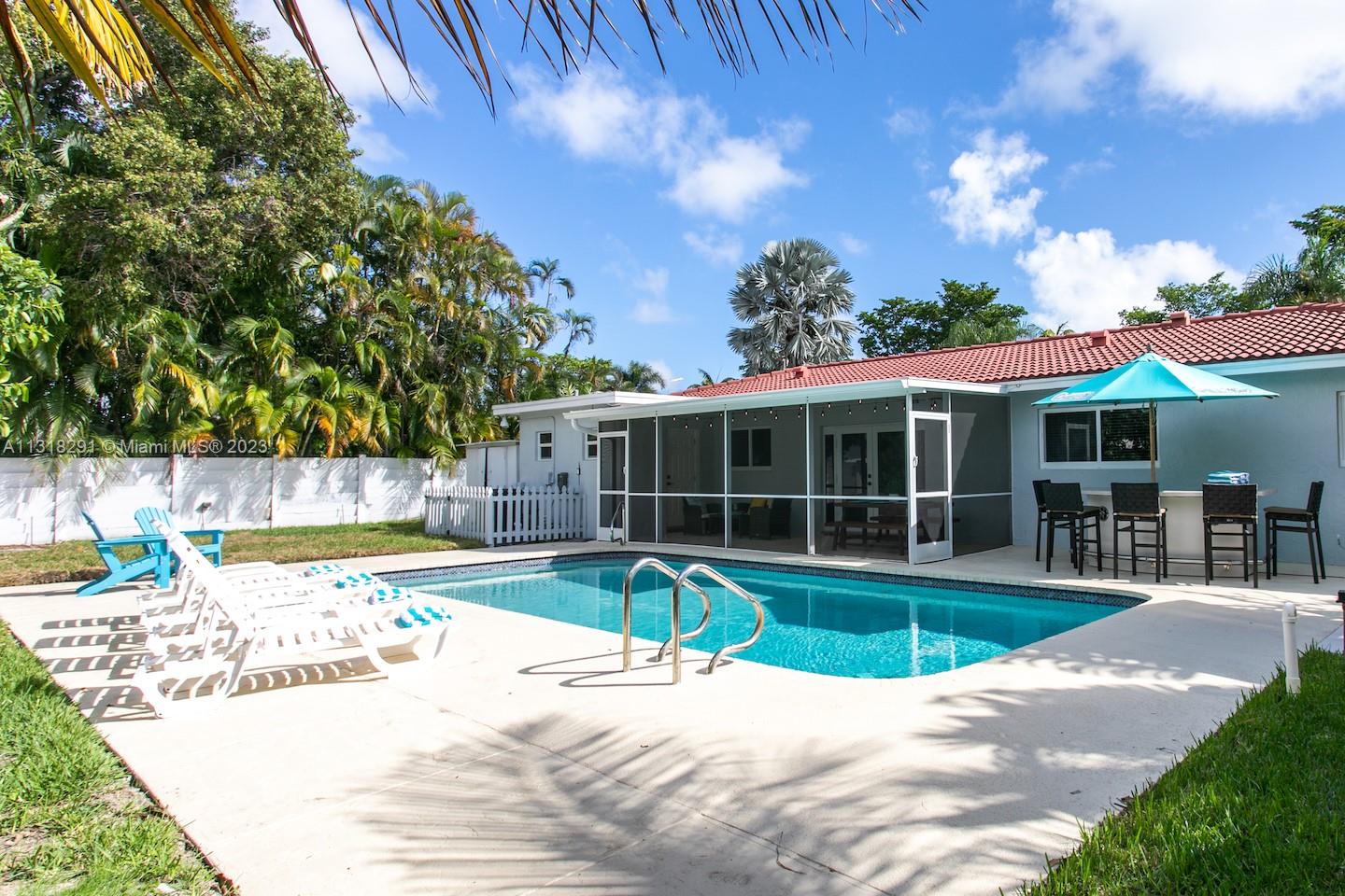 a view of a swimming pool with a patio