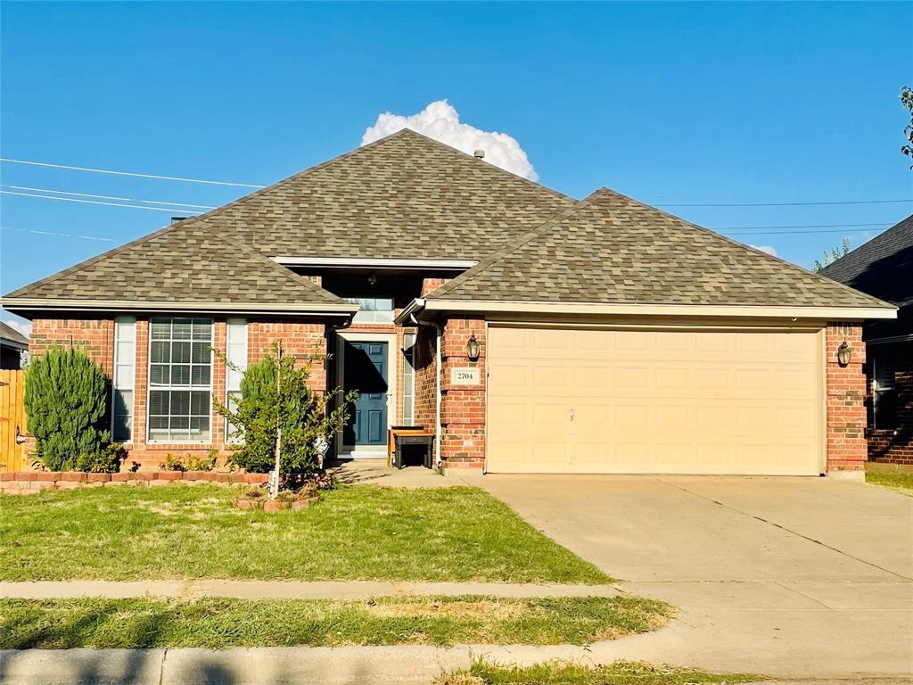 a view of house with yard