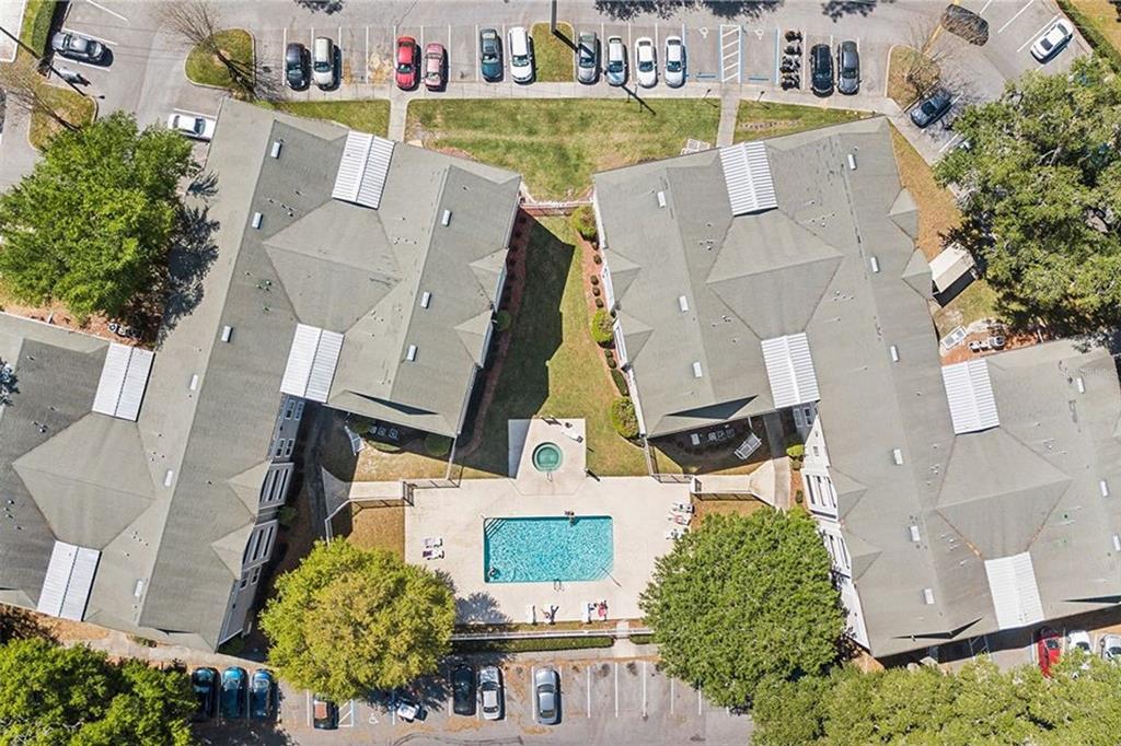 an aerial view of a house with a swimming pool