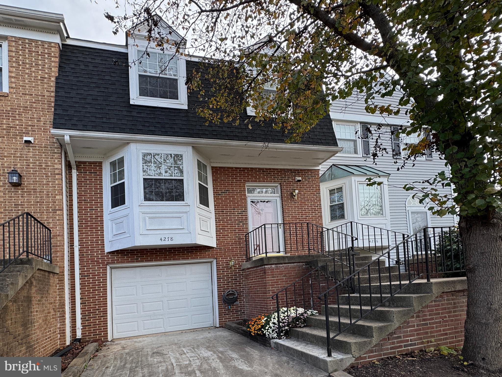 a front view of a house with a garage