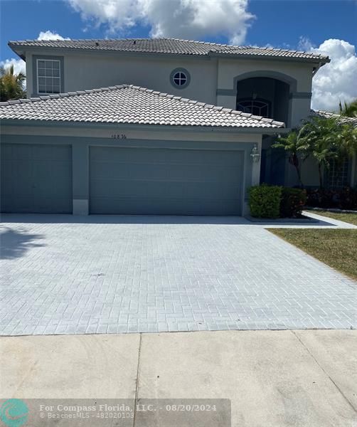 a front view of a house with yard