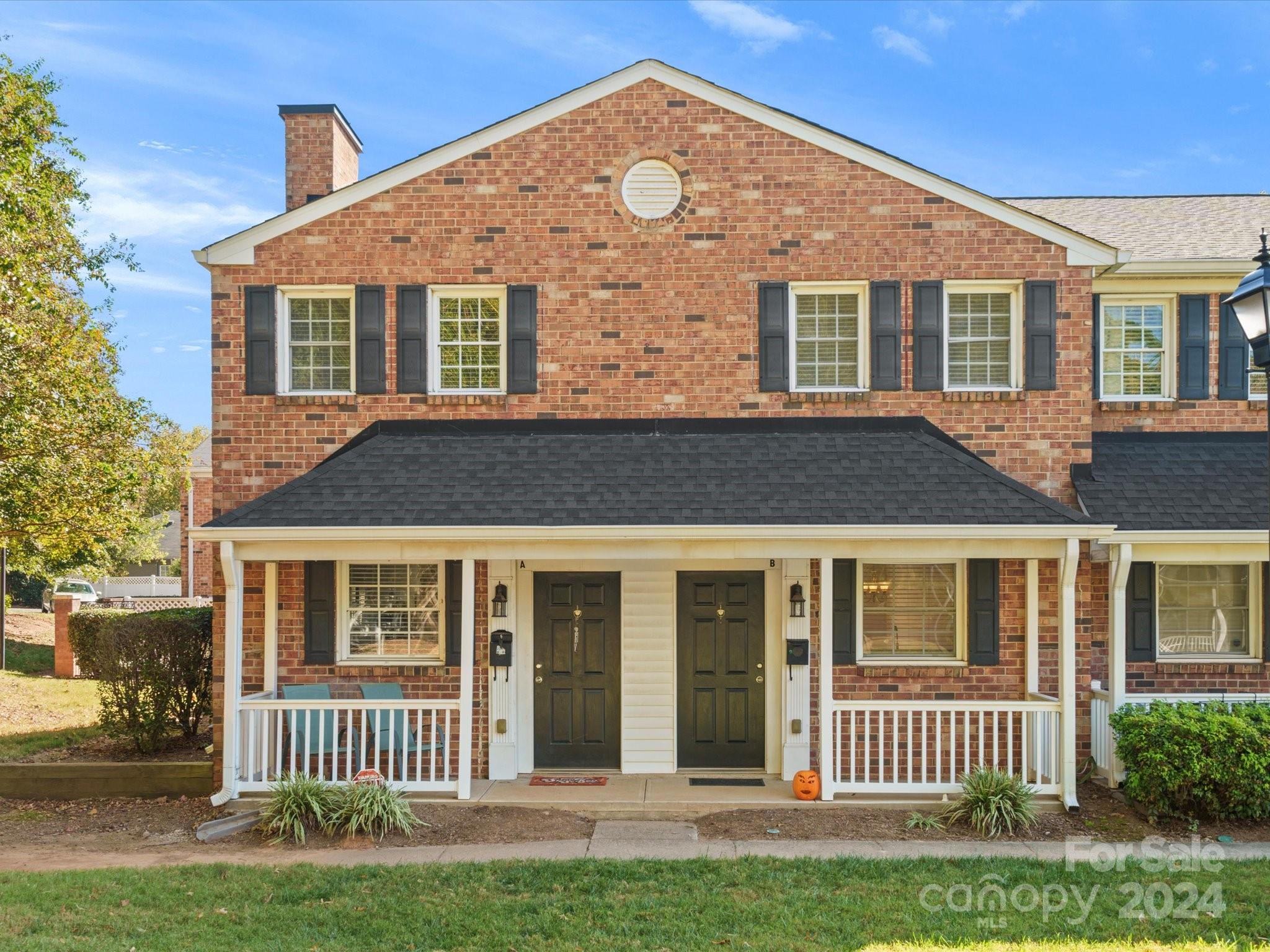 front view of a house with a garden