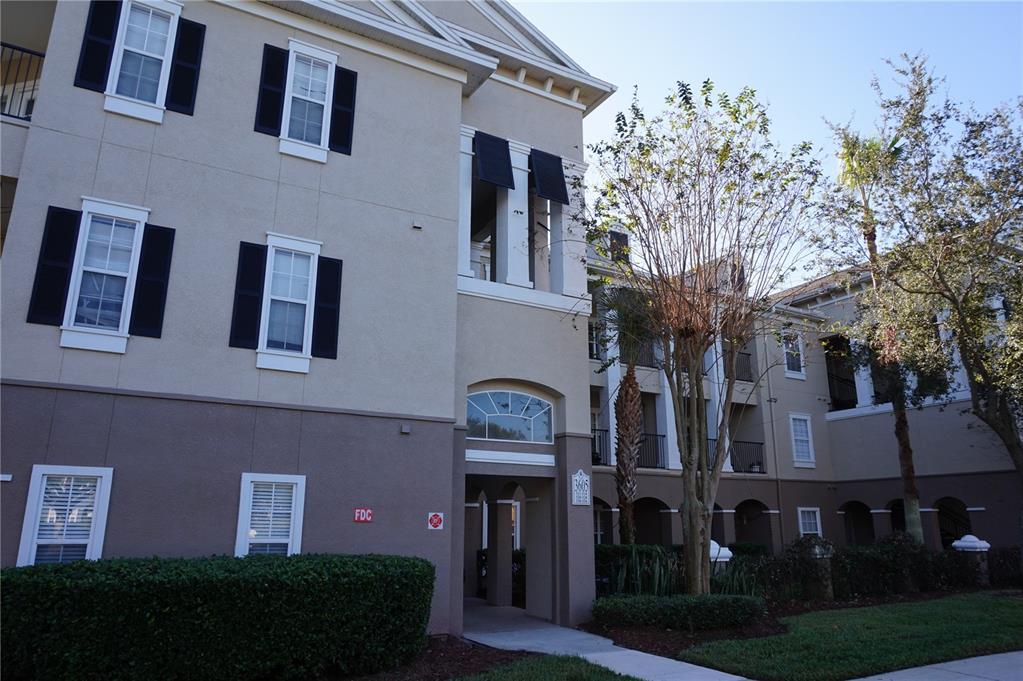 a view of a building with a yard