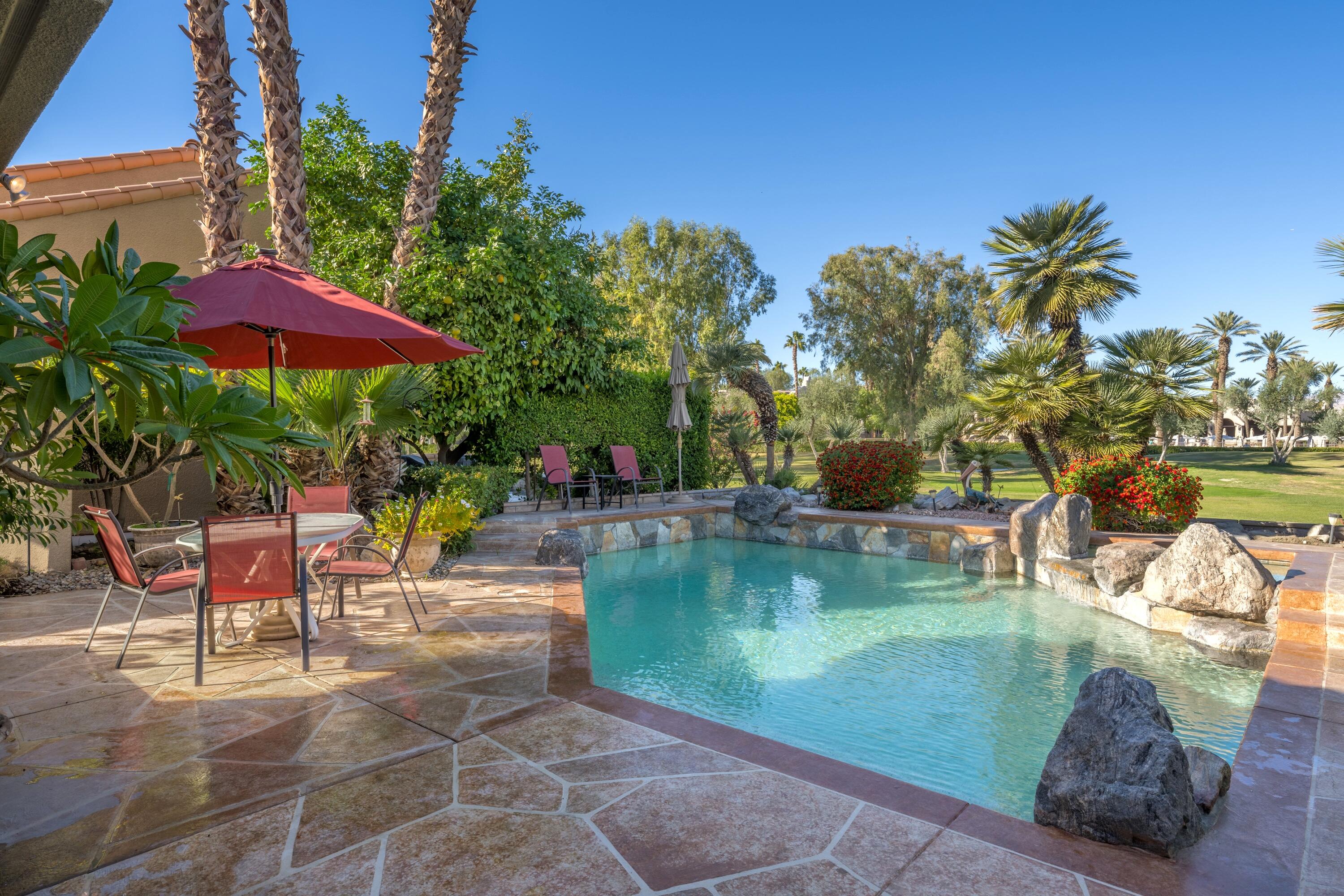 a view of a swimming pool with a patio