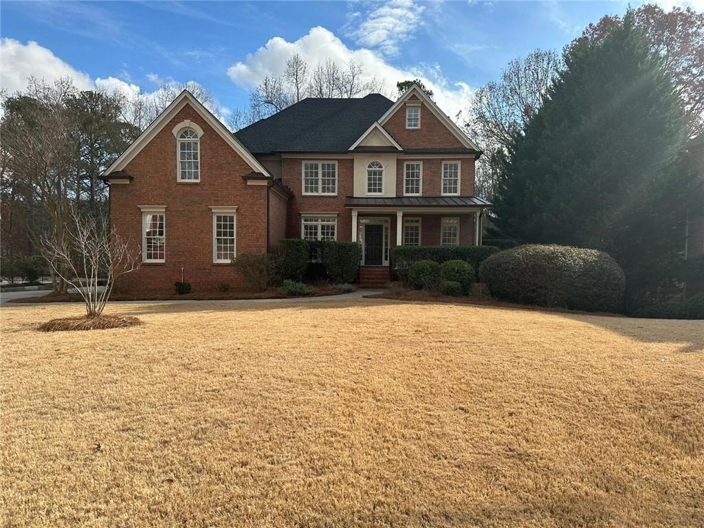 a front view of a house with a yard