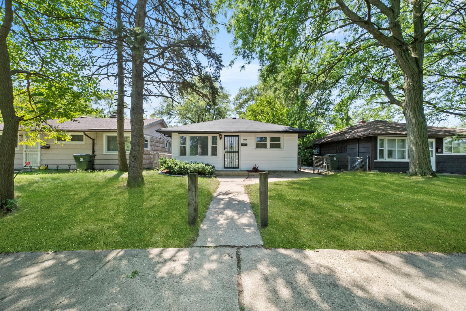 front view of a house with a yard