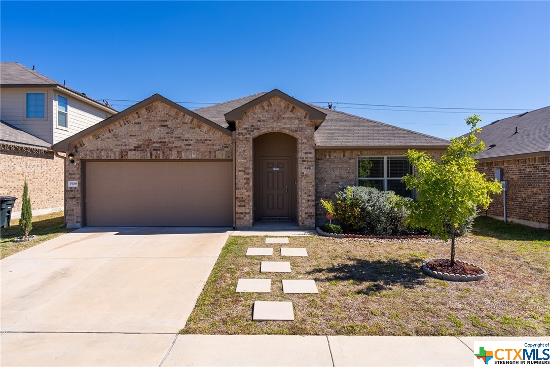 a front view of a house with yard