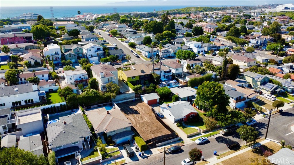 an aerial view of a houses with yard