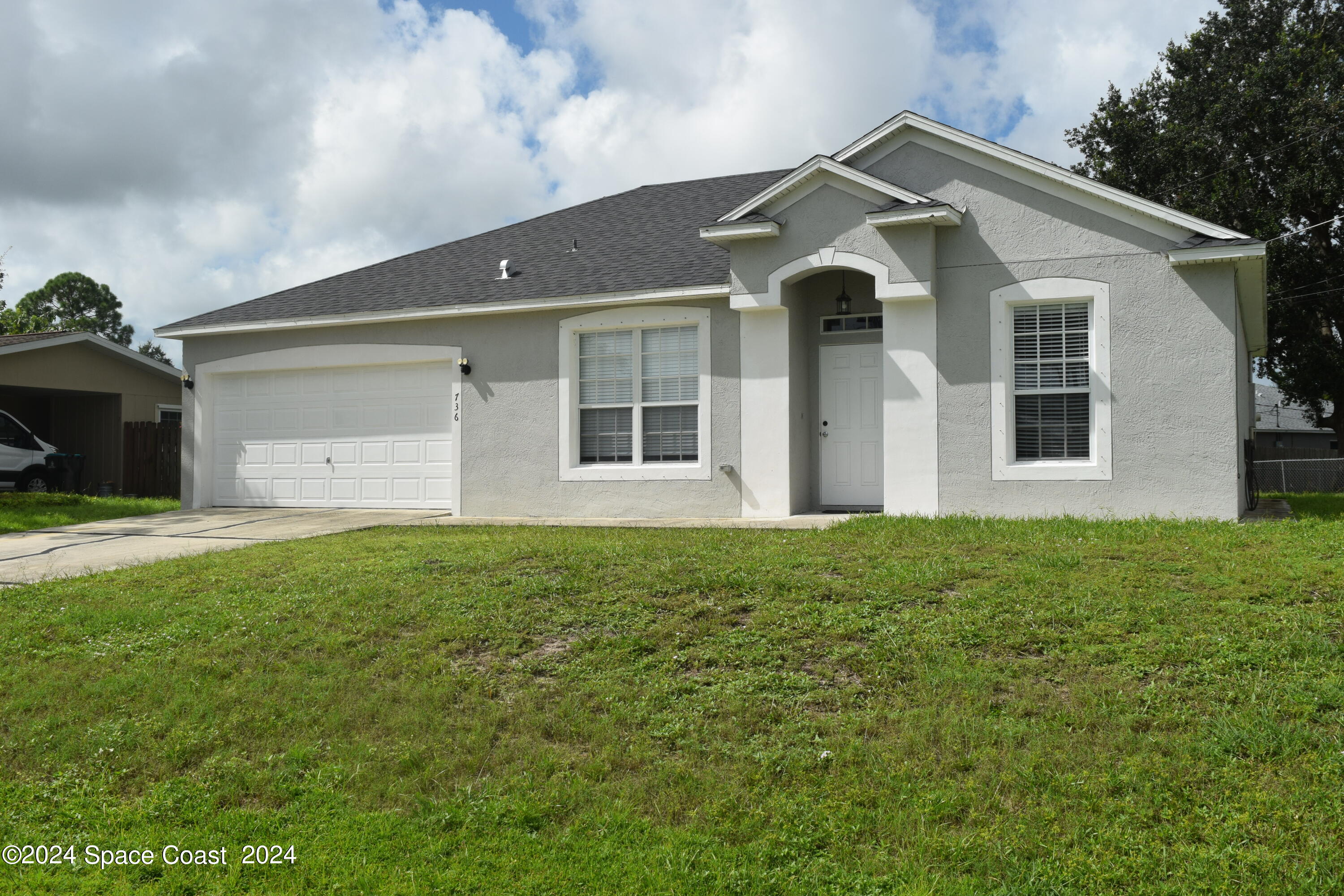 front view of a house with a yard